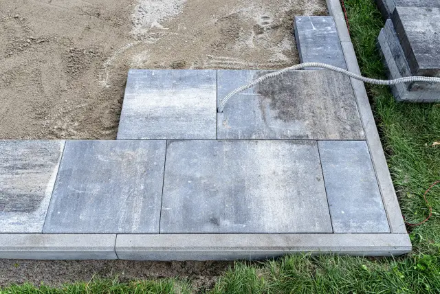 Paver patio being installed on a Montclair, NJ landscape construction job