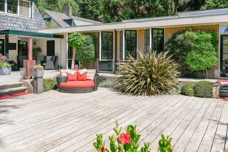 Backyard with a wooden deck and patio built in Montclair, NJ